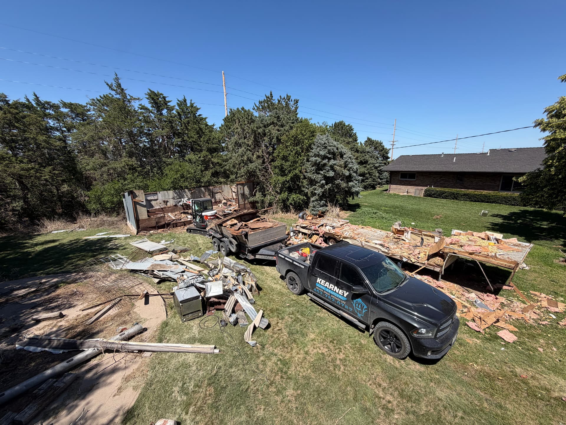 Camper and Hog Pin Demo Near Axtell Opens Up Usable Yard Space image