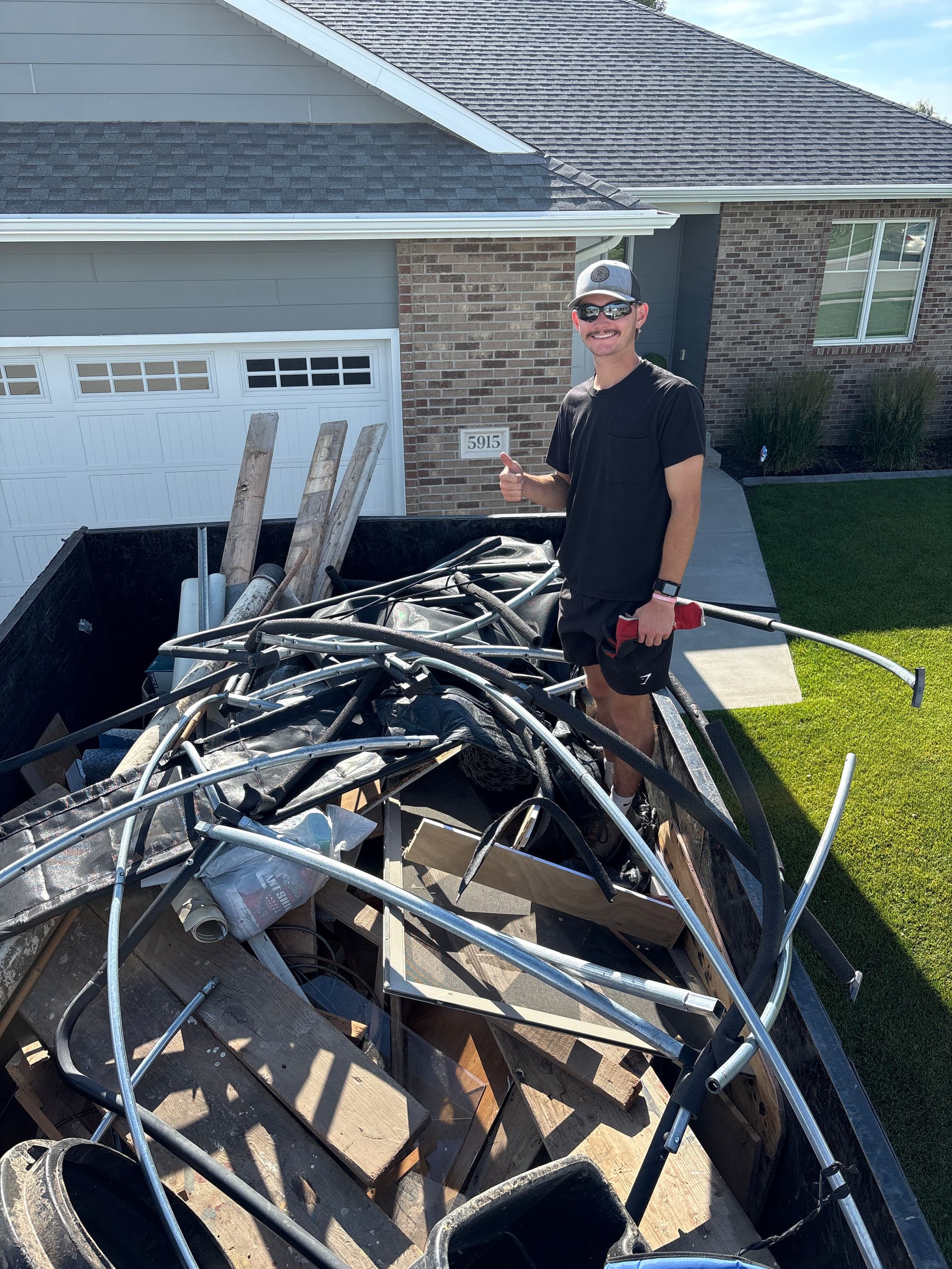 Rusted Trampoline Hauled Away for a Cleaner Backyard image